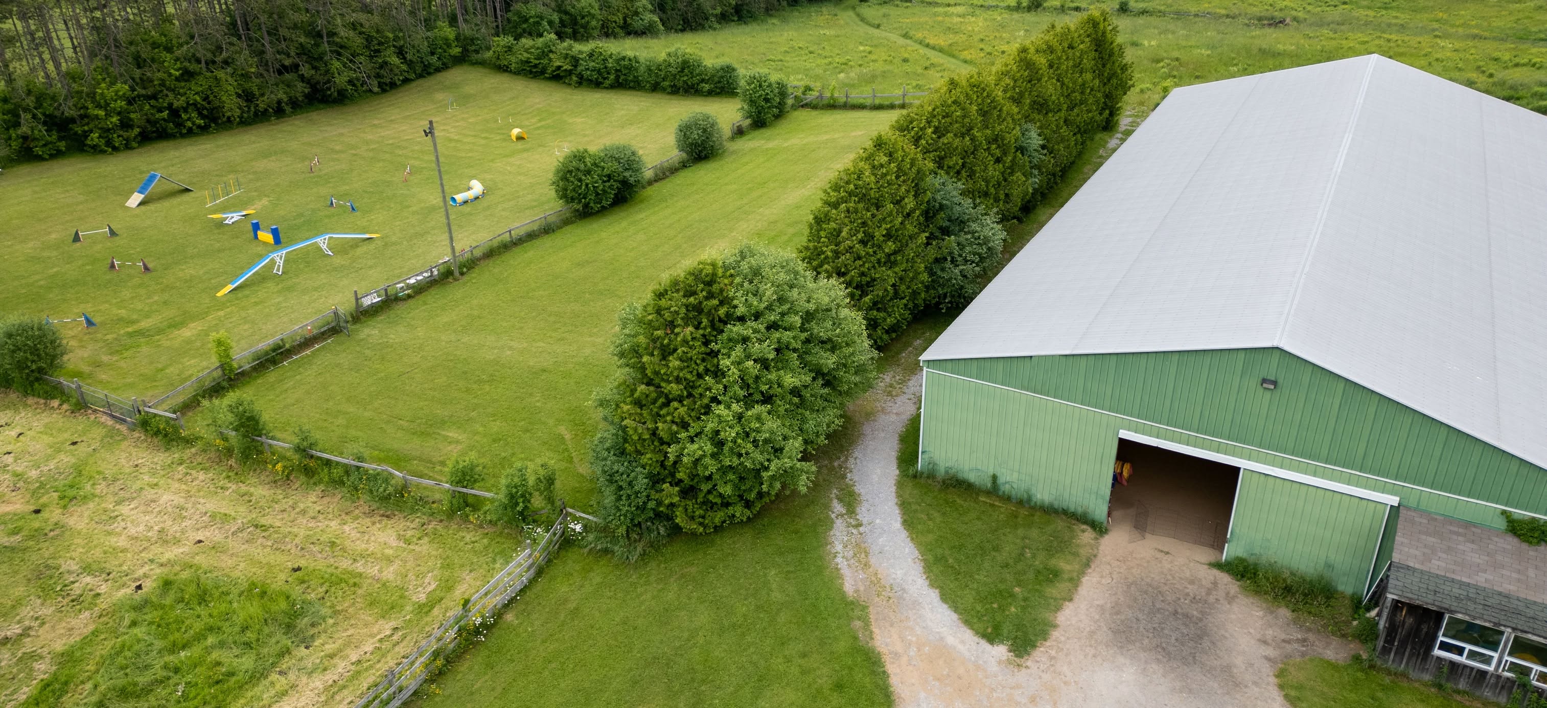 Aerial view of the Bar Stars Agility Club training barn and outdoor course field